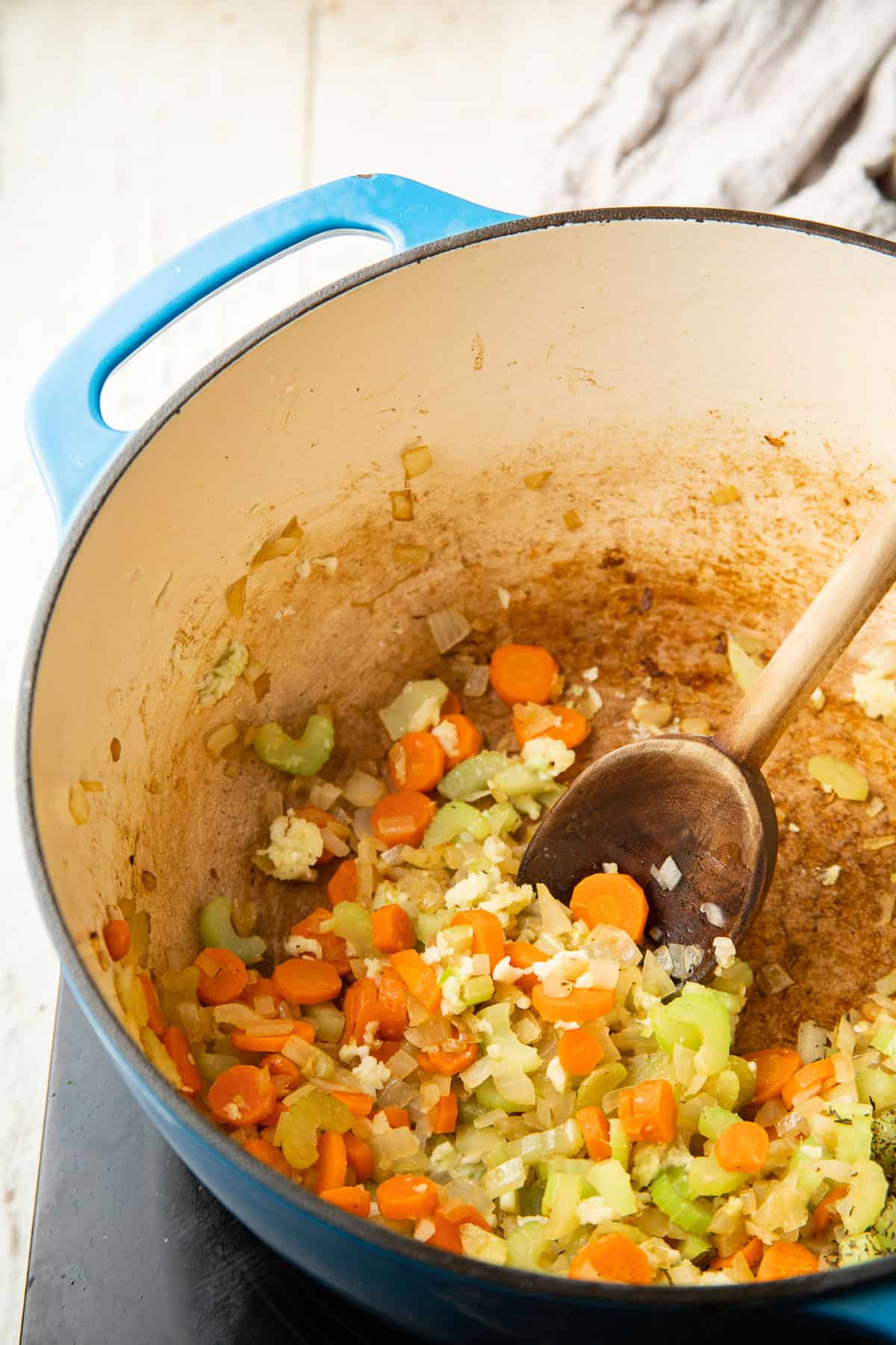 Cook onion, carrot, celery and garlic in a pot.