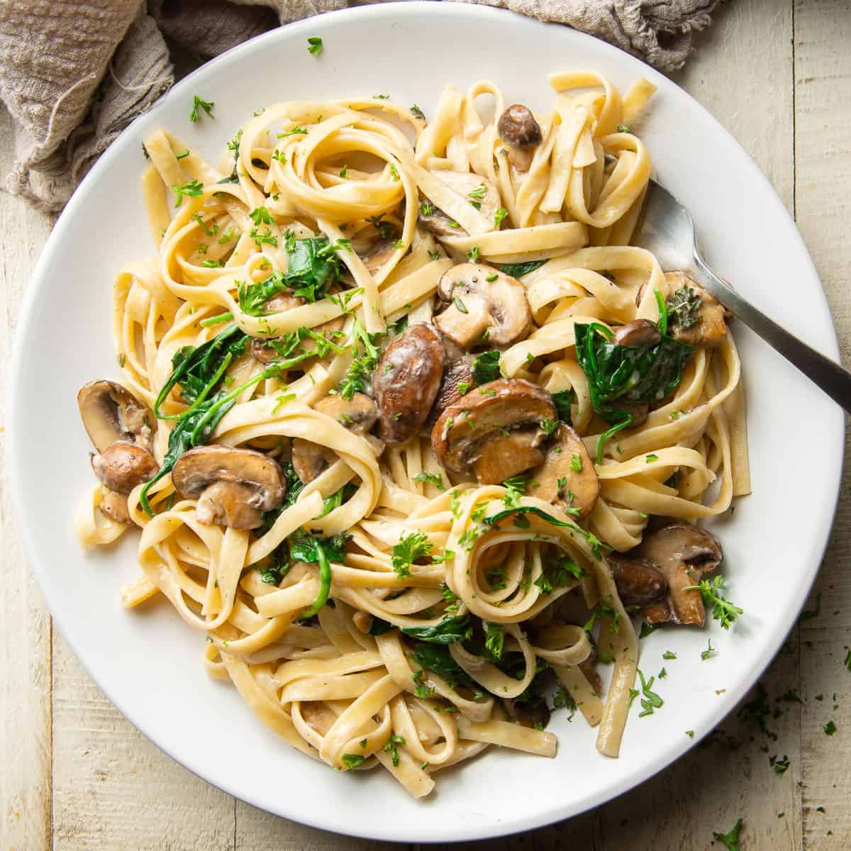 Plate of Vegan Mushroom Pasta with a fork.