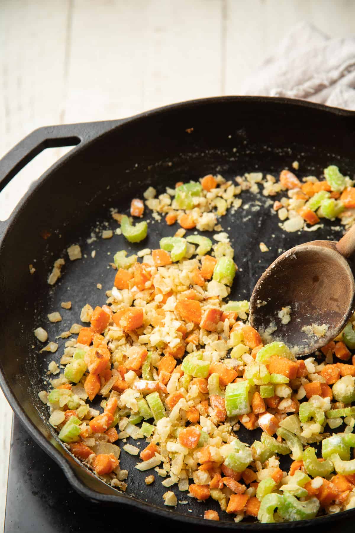Celery, carrot, onion, garlic and flour cooked in a pan.