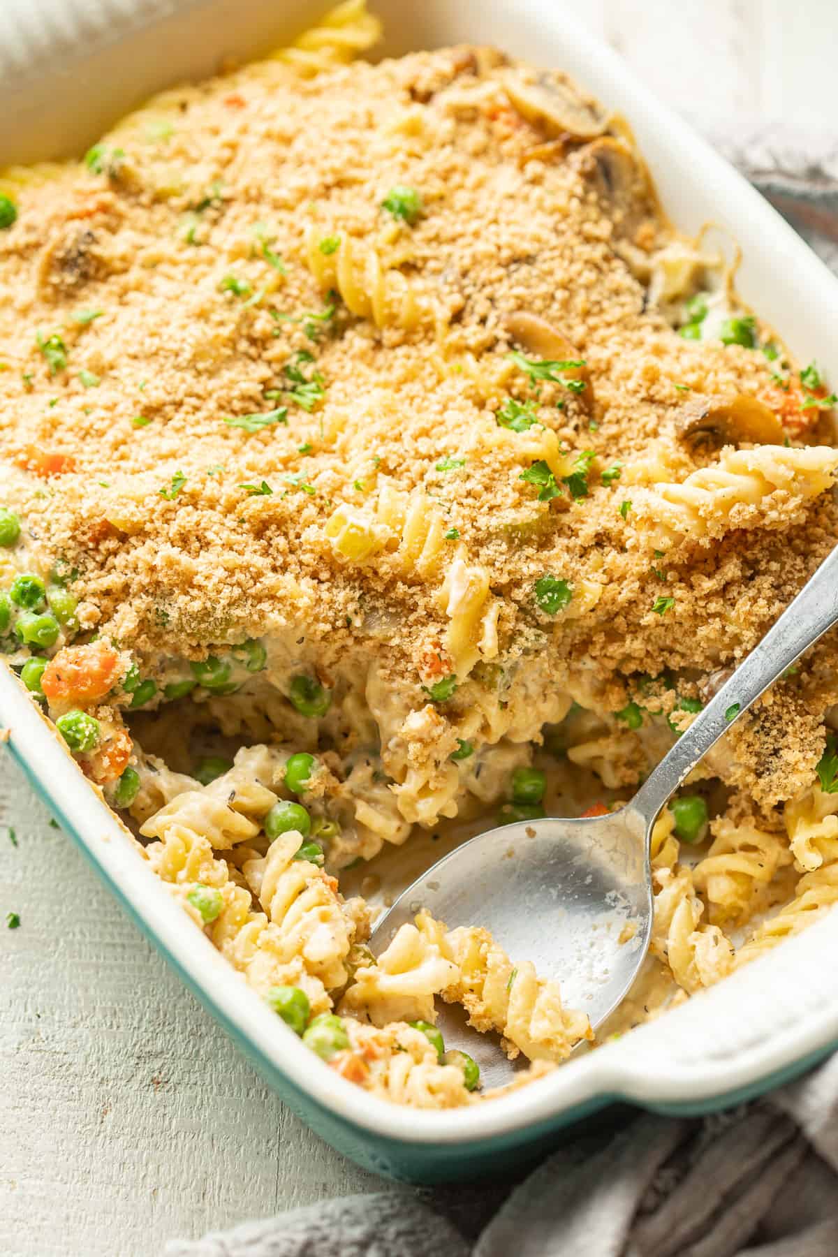 Vegan Noodle Casserole in a baking dish with spoon.
