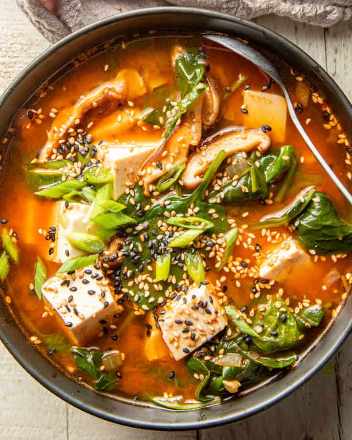 Bowl of Korean Tofu Soup with spoon.