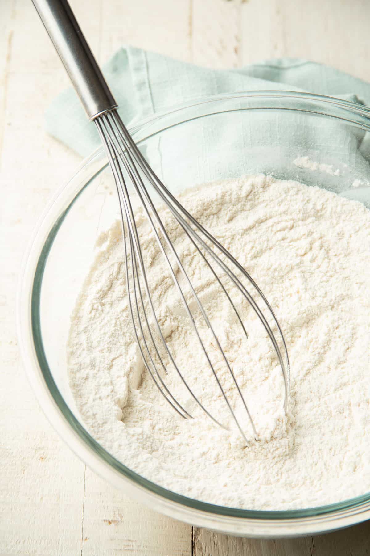 Dry ingredients in a mixing bowl with whisk.