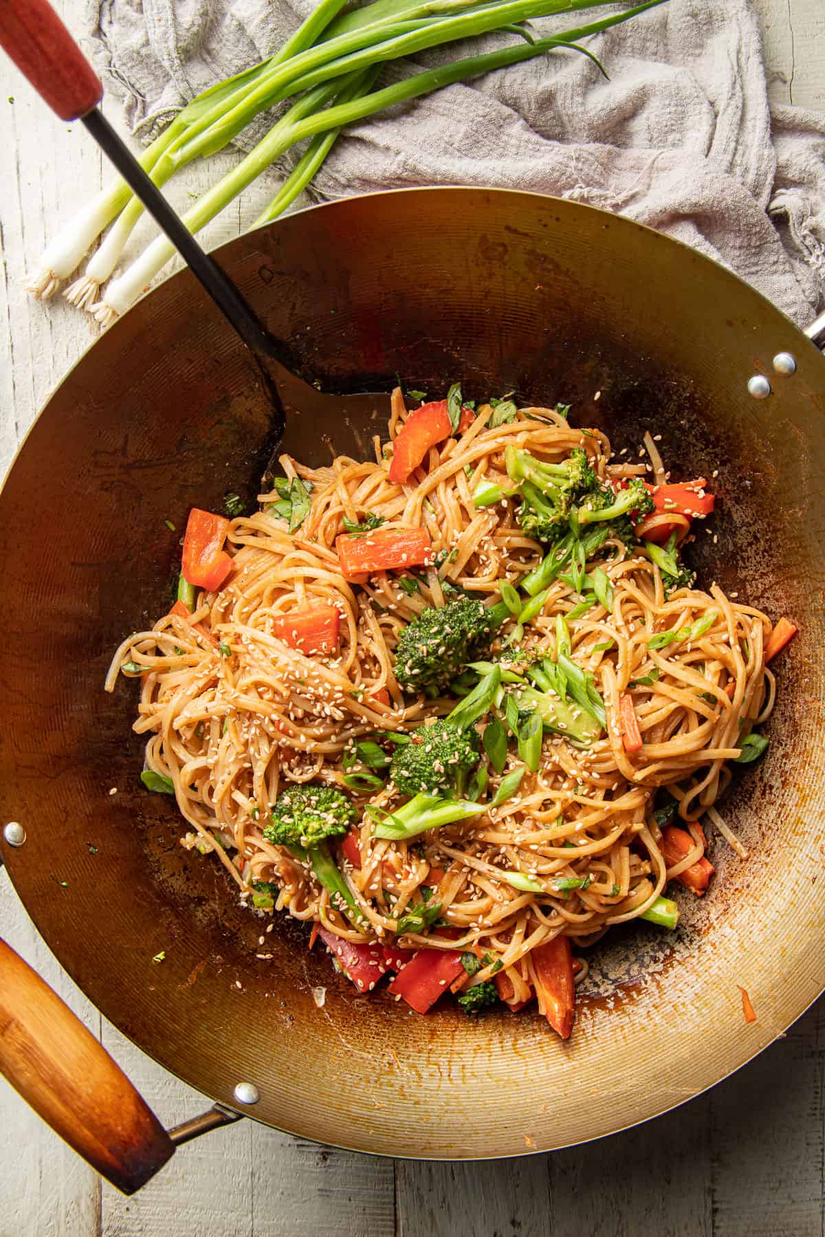 Hoisin Noodles and vegetables in a wok.