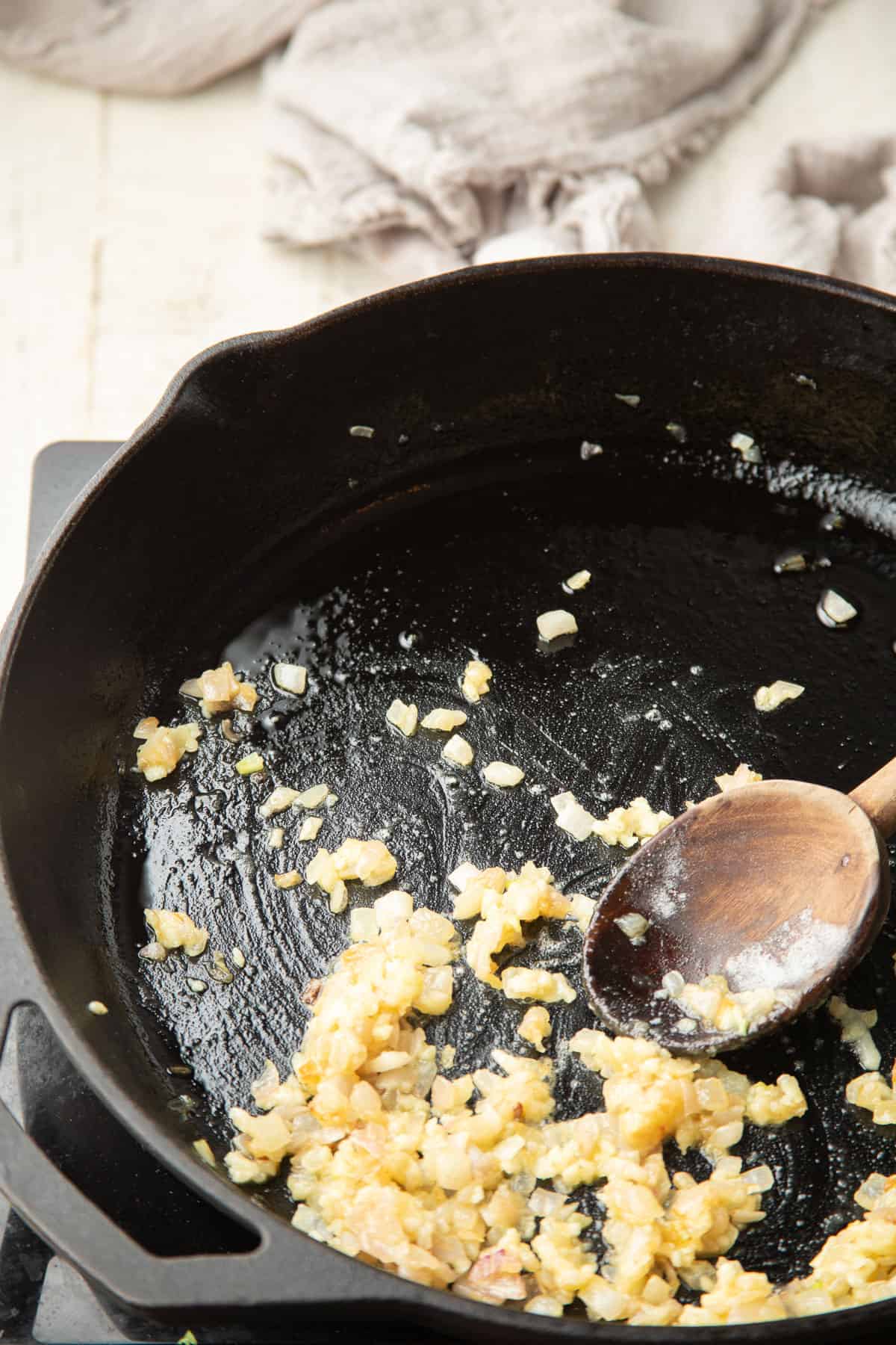 Shallots and flour cooking in oil in a skillet.