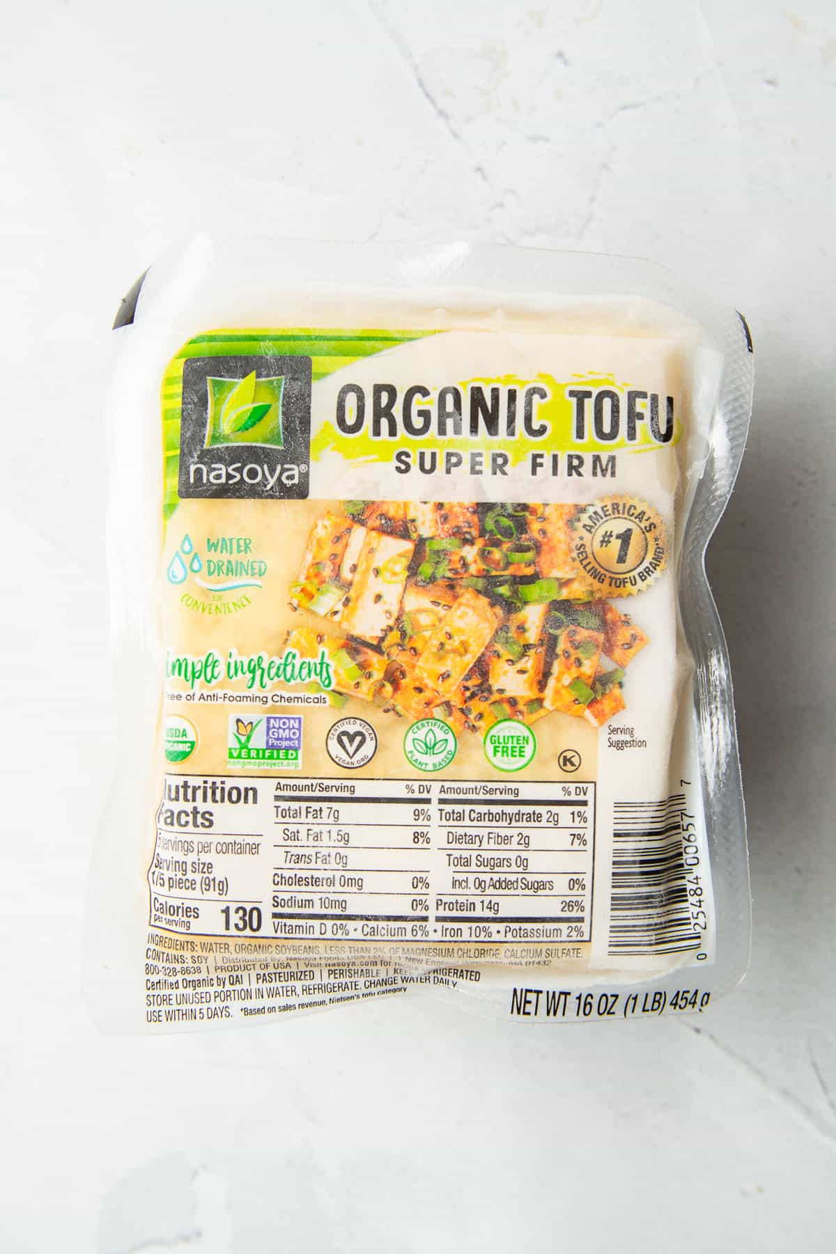 Block of frozen super firm tofu in it's original packaging.