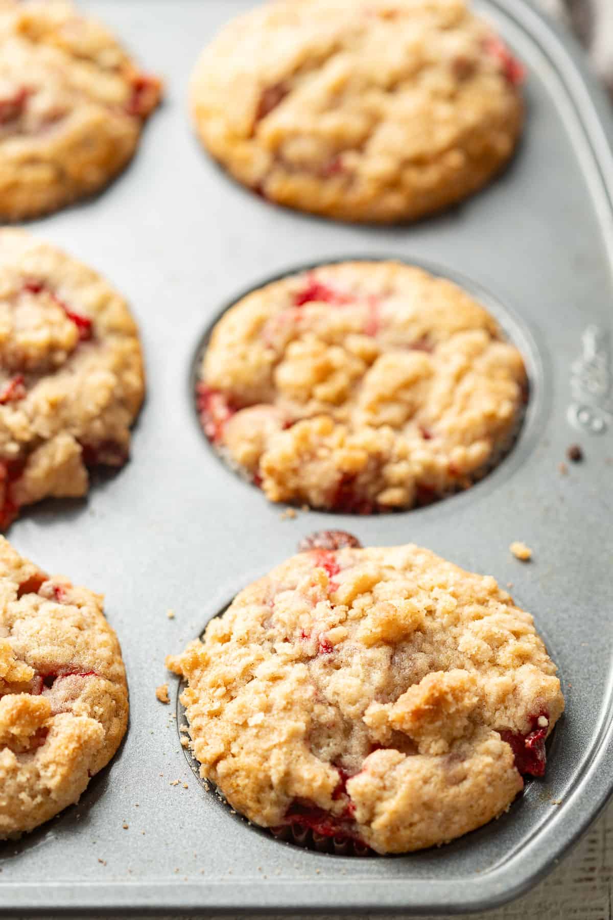Vegan Strawberry Muffins in a muffin tin.