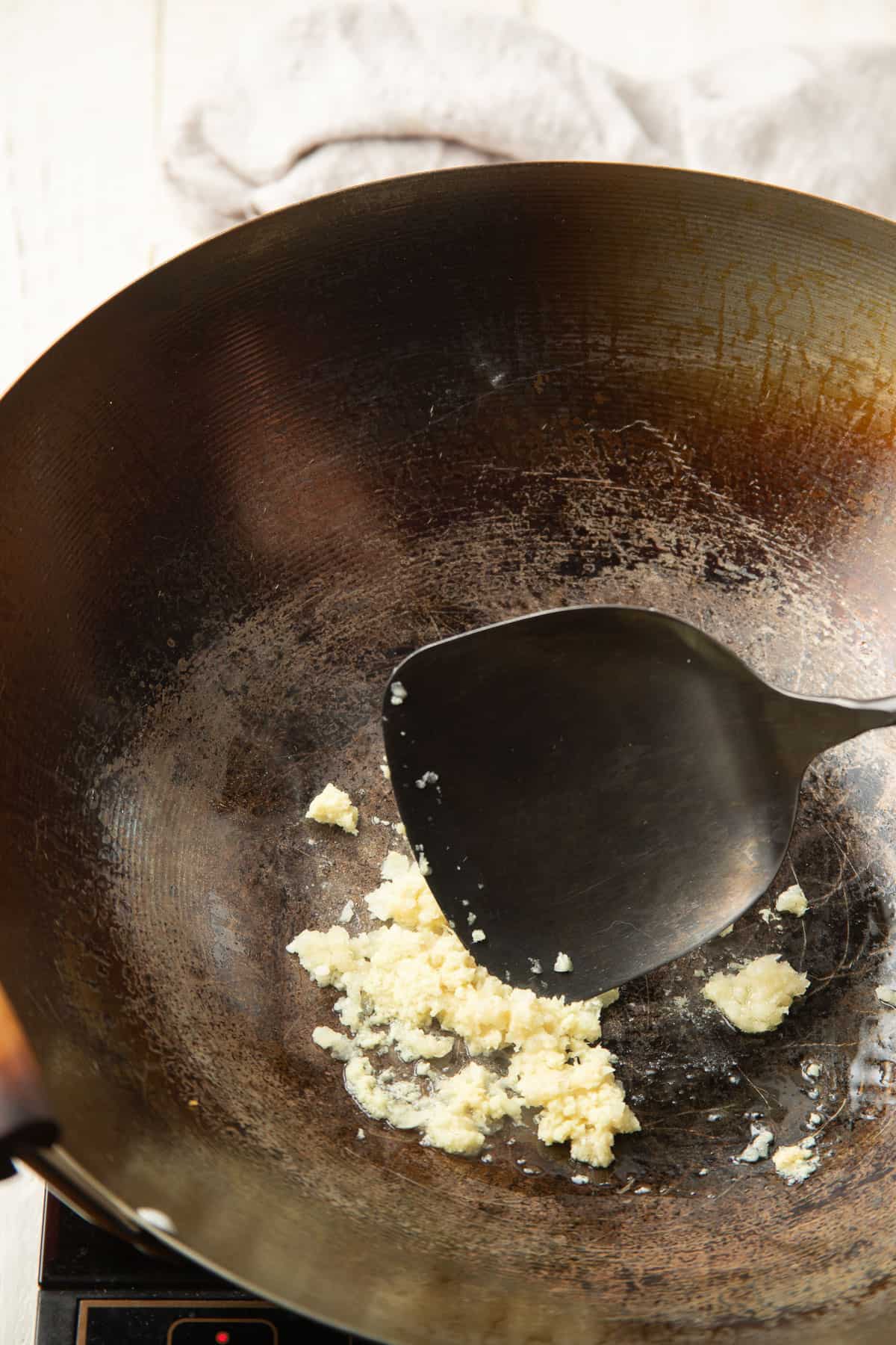 Garlic cooking in a wok.