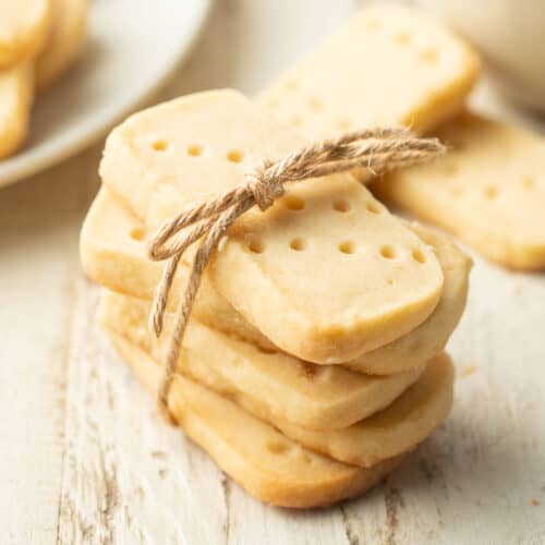 Stack of Vegan Shortbread Cookies tied together in with a piece of twine.