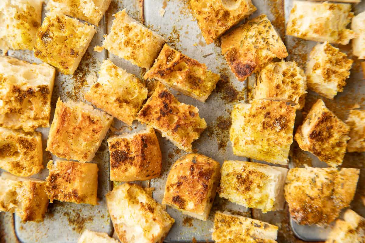 Curry croutons on a baking sheet.