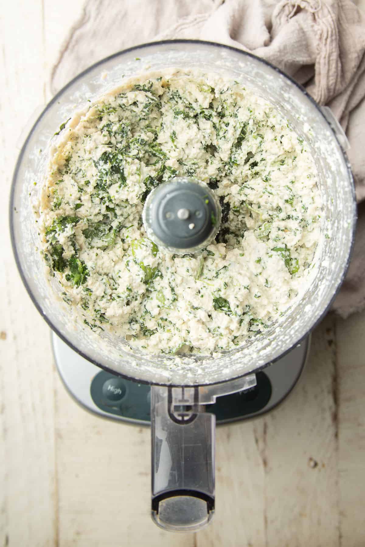 Vegan spinach ricotta in a food processor bowl, just after blending.