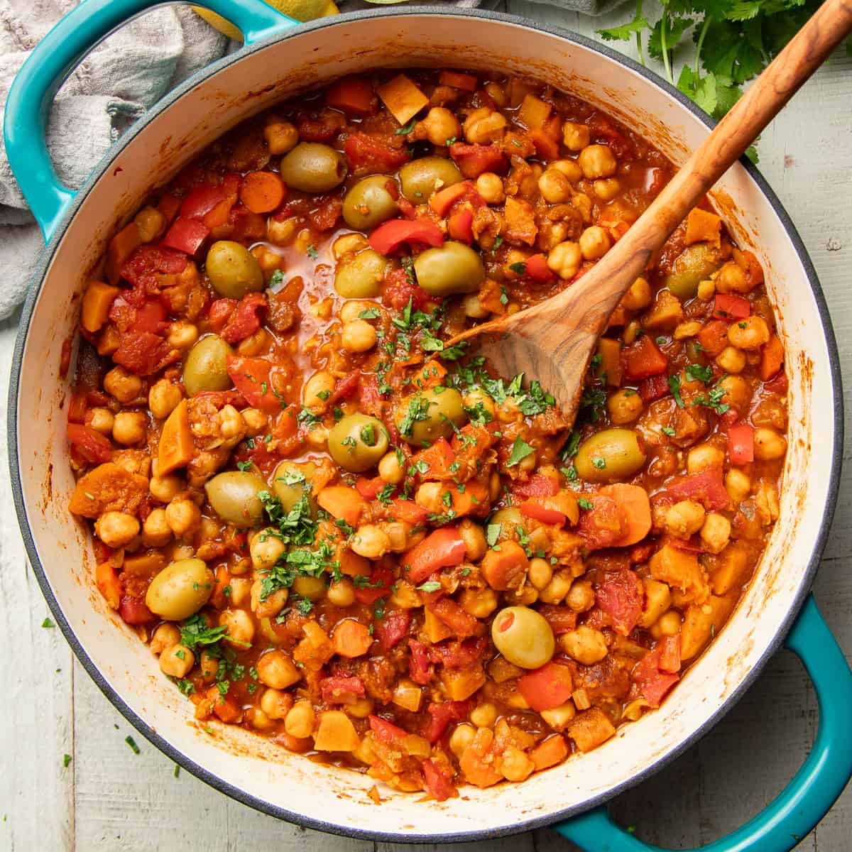 Pot of Vegan Tagine with a wooden spoon.