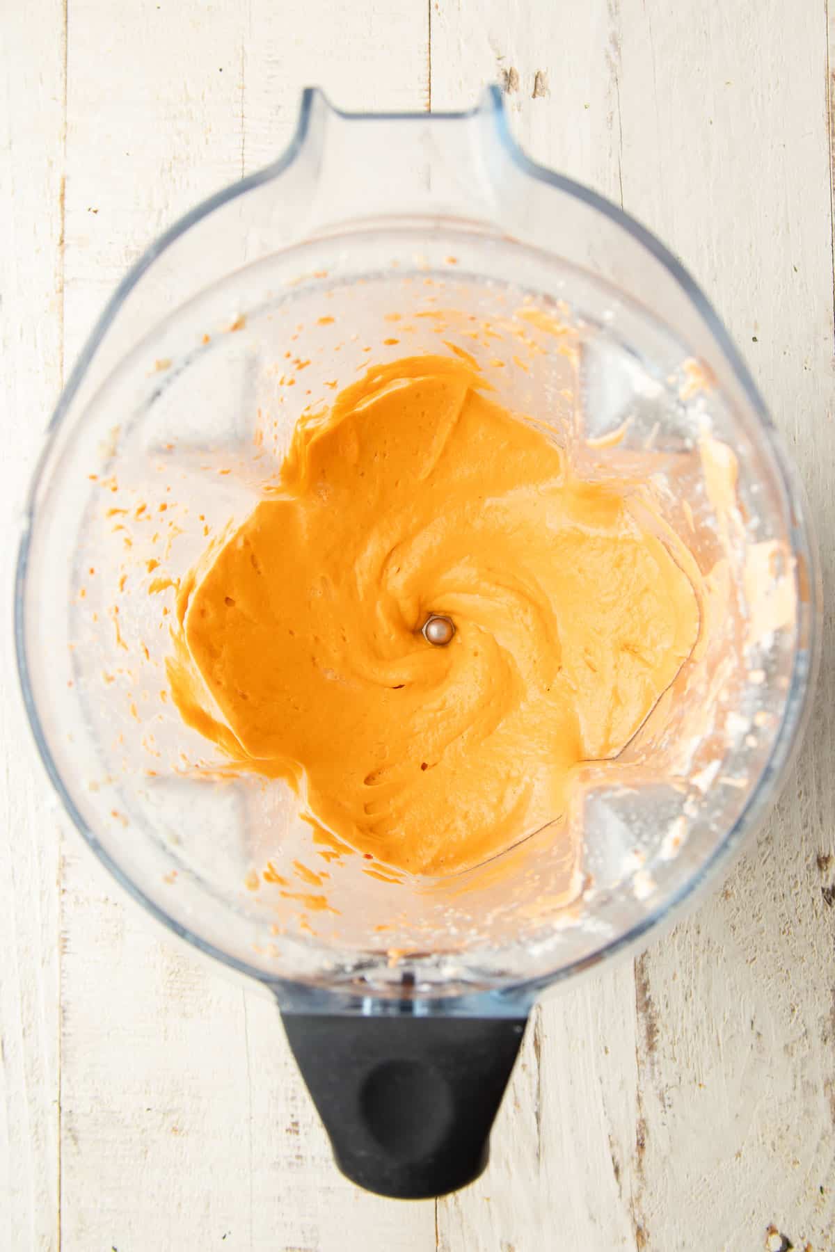 Creamy sundried tomato sauce in a blender.