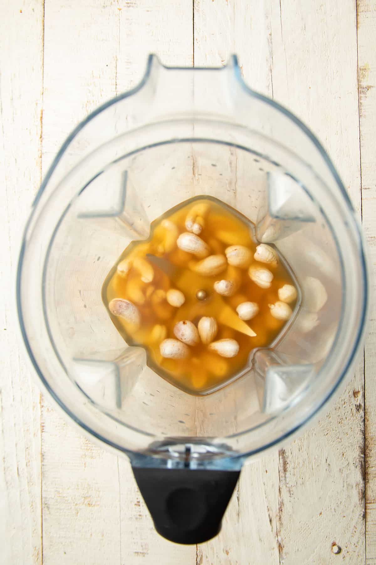 Cashews and broth in a blender.