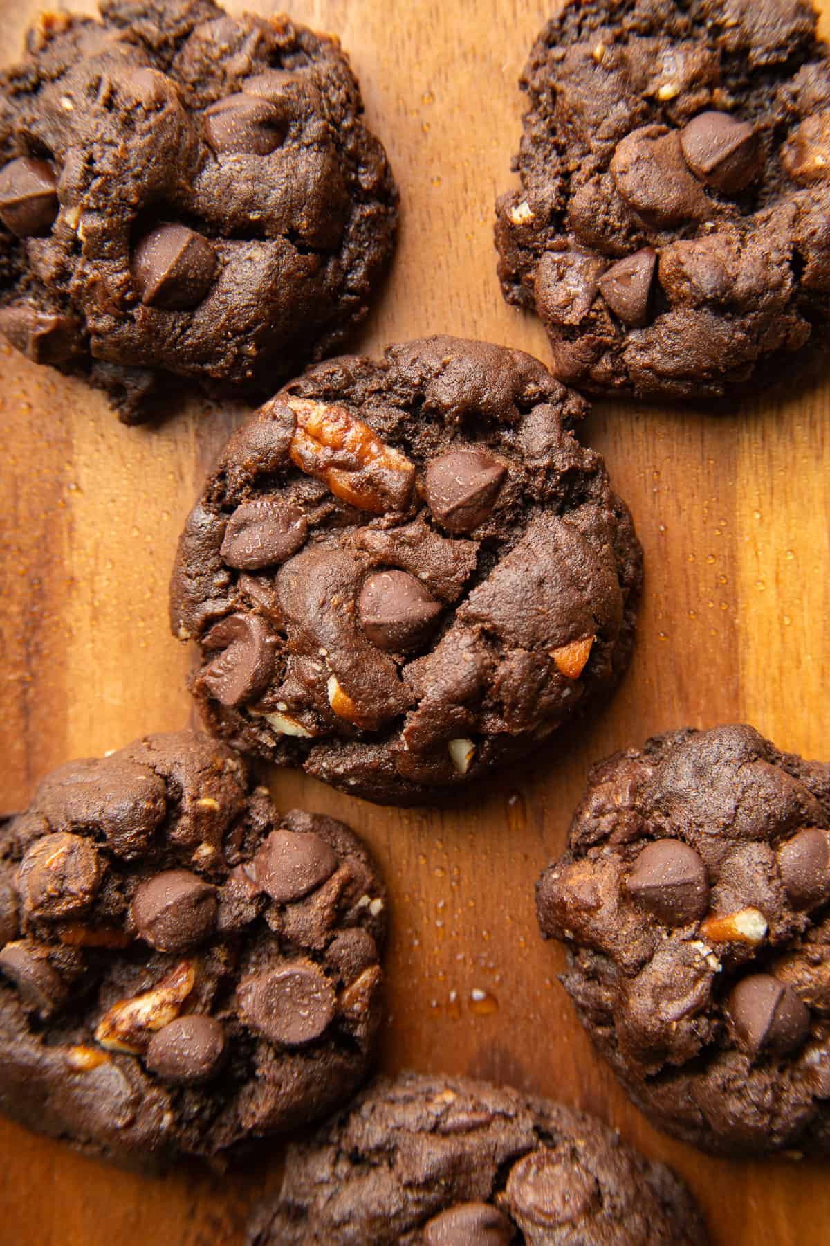 Vegan Double Chocolate Cookies on a wooden surface.