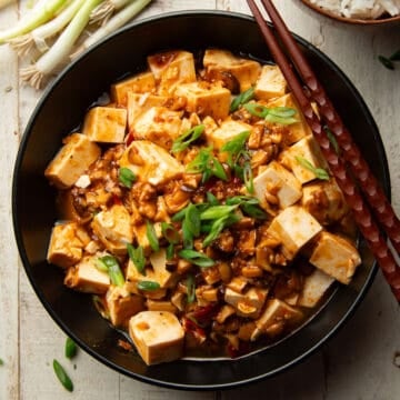 Bowl of Vegan Mapo Tofu with chopsticks.