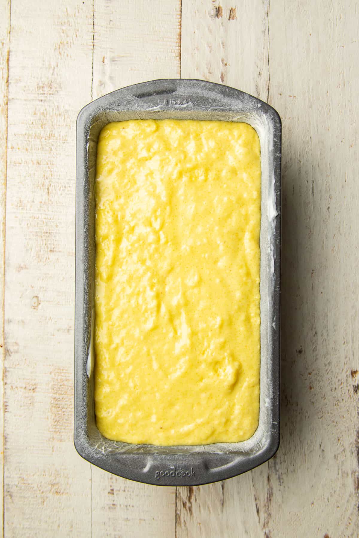 Lemon loaf batter in a loaf pan.