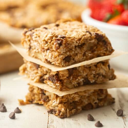 Stack of three Breakfast Bars with parchment paper between them.