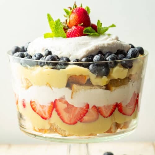 Vegan Berry Trifle made with layers of cake, custard, whipped topping, and berries.