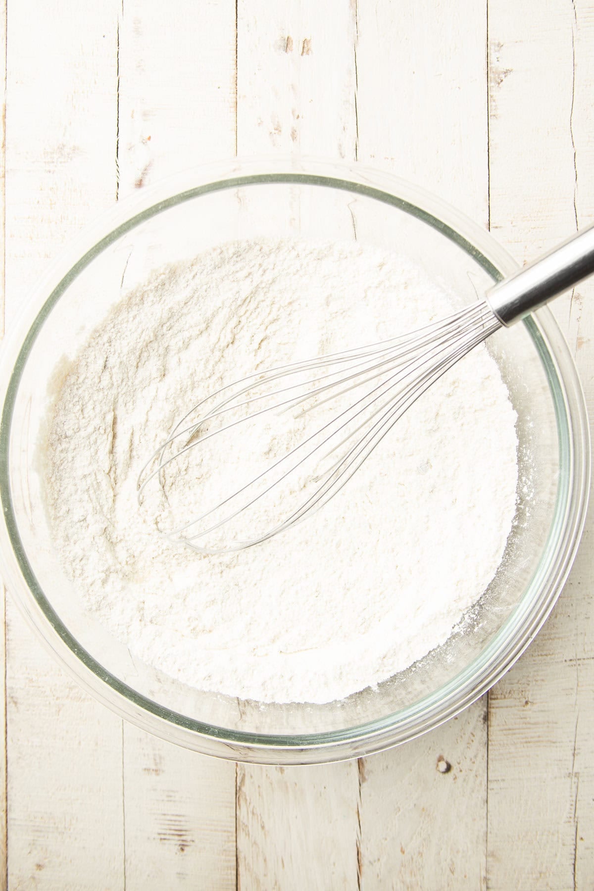 Dry ingredients for Peanut Butter Bread in a mixing bowl with wire whisk.