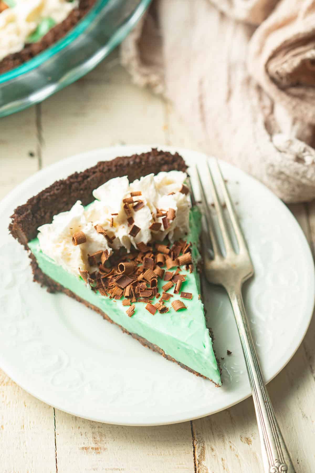 Slice of Vegan Grasshopper Pie on a plate with a fork.