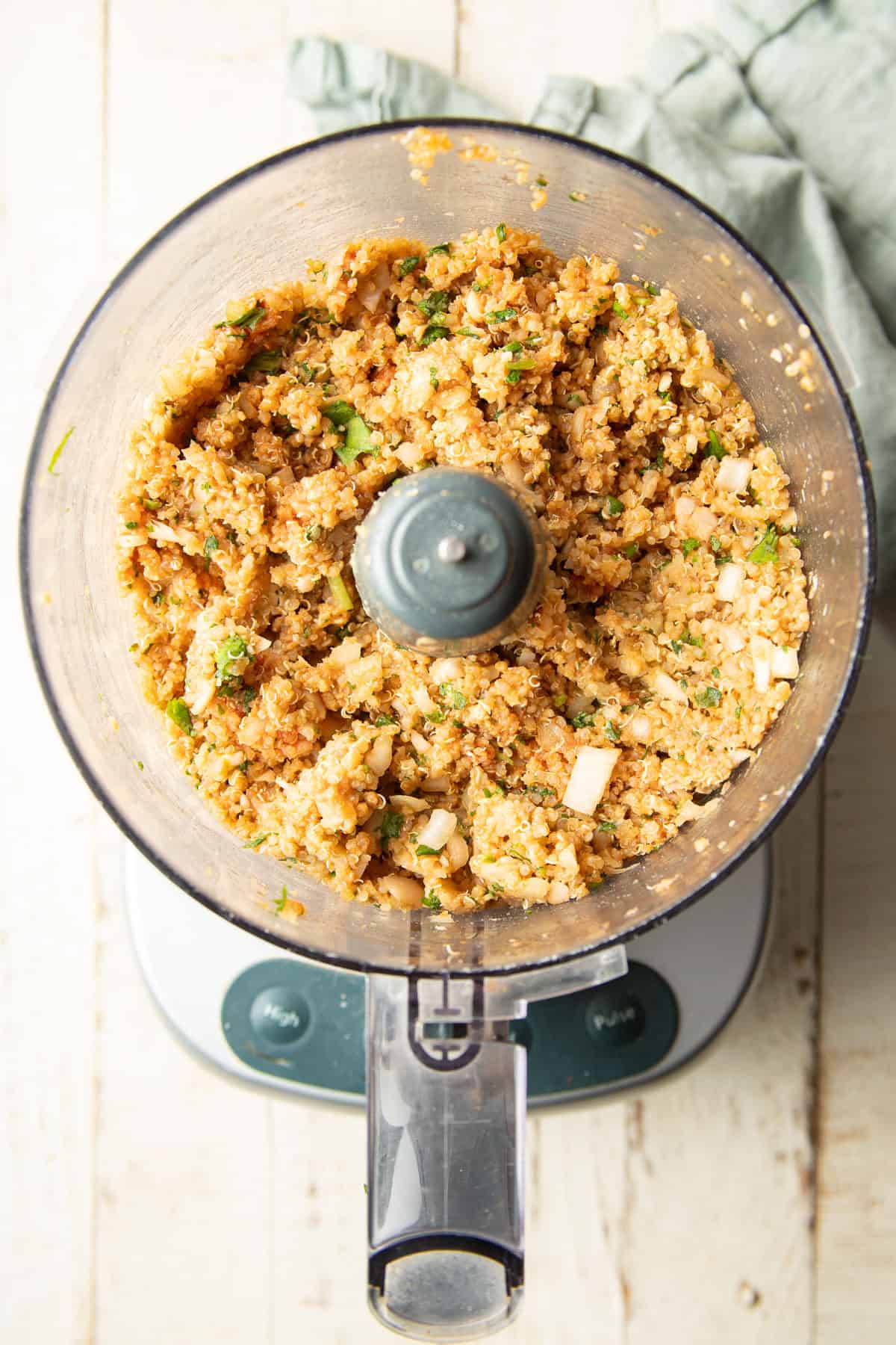 Blended Quinoa Meatball ingredients in a food processor.