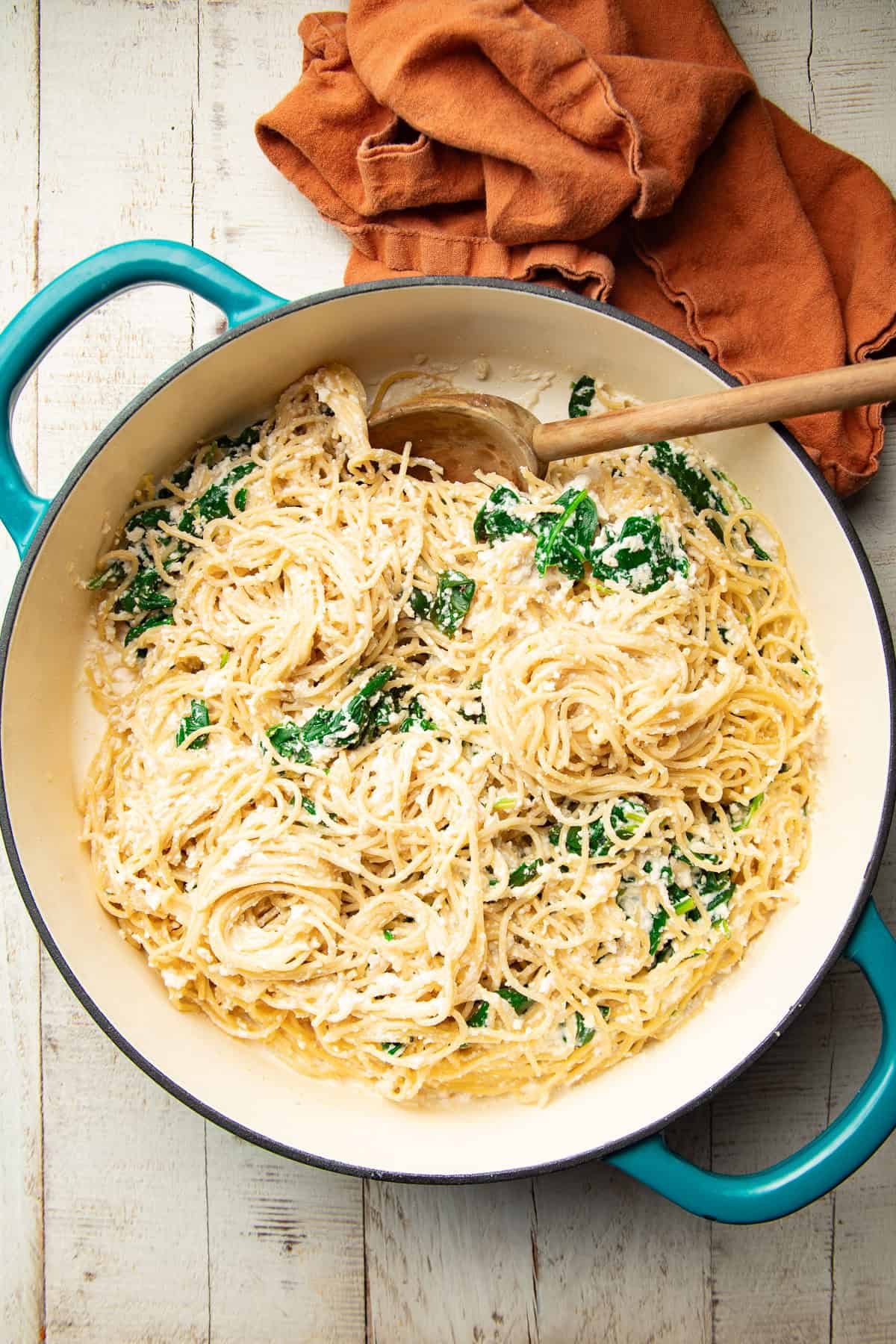 Pot of Vegan Lemon Ricotta Pasta with a wooden spoon.