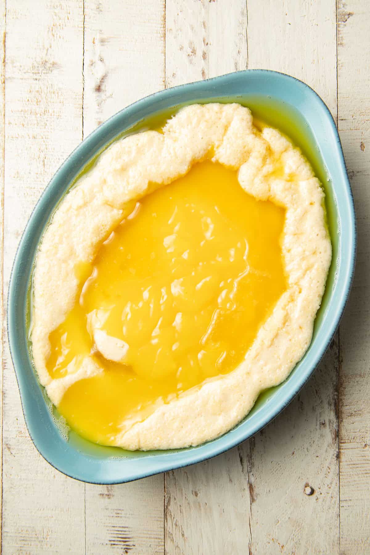 Unbaked lemon cobbler in a baking dish.