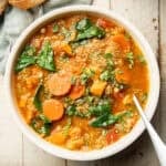 Bowl of Quinoa Soup with spoon.