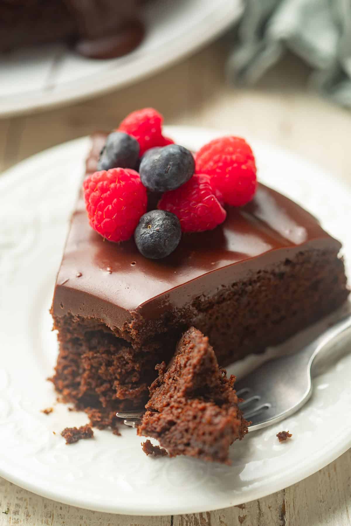 Vegan Chocolate Olive Oil Cake with a bite taken out and sitting on a fork.