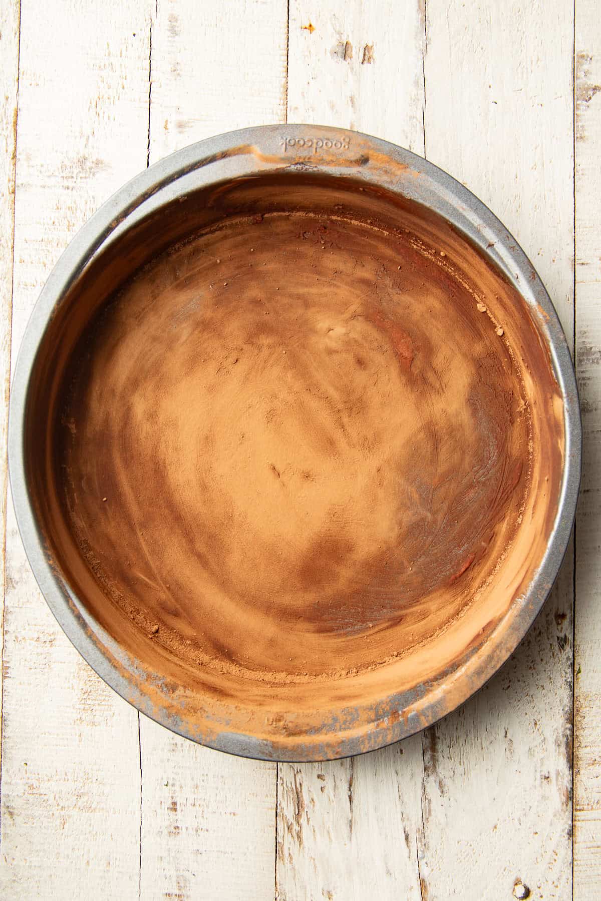 Round cake pan greased with shortening and dusted with cocoa.