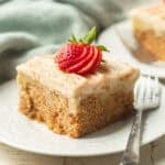 Slice of vegan poke cake on a dish with fork.