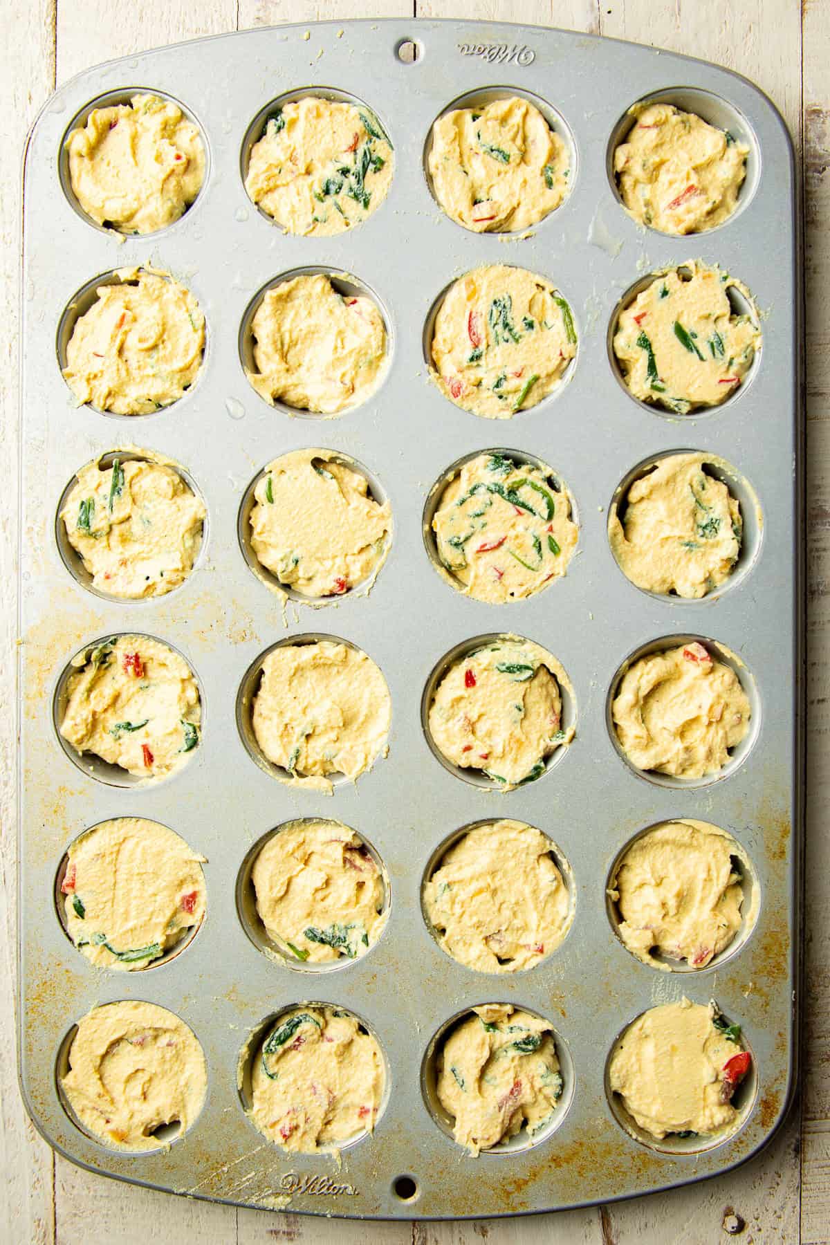Unbaked Vegan Egg Bites in a mini muffin tin.