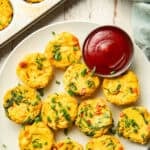 Plate of Vegan Egg Bites with dish of ketchup.
