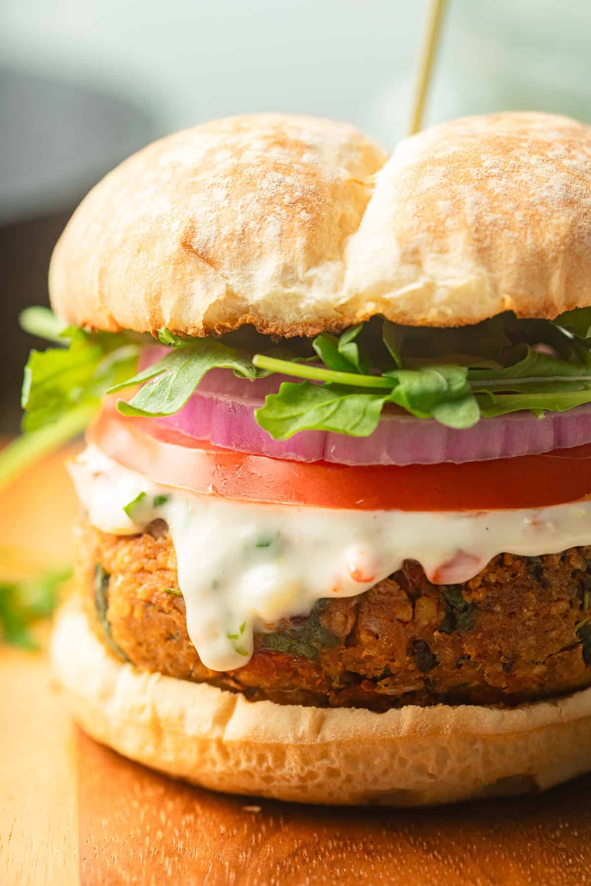 Marry Me Chickpea Burger on a wood surface.