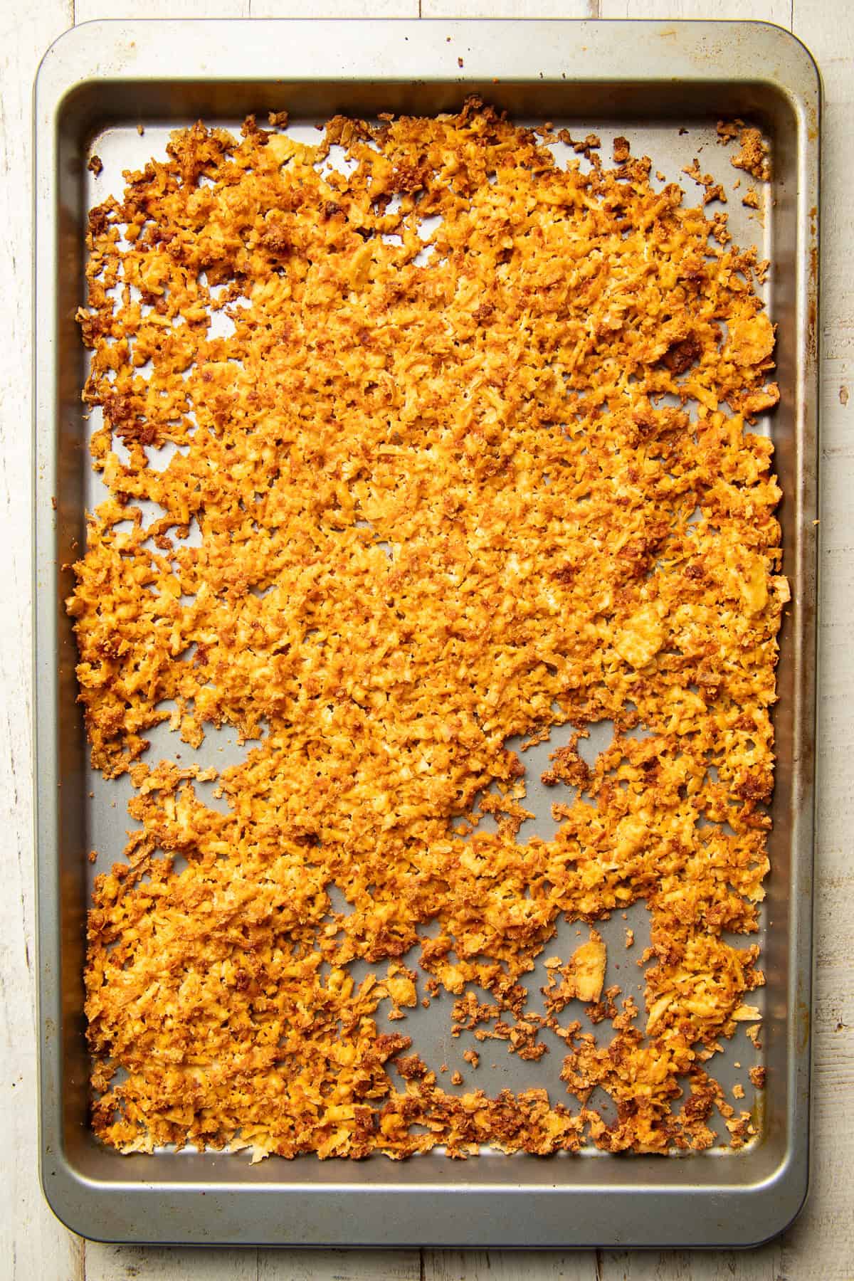 Baked shredded tofu on a baking sheet.