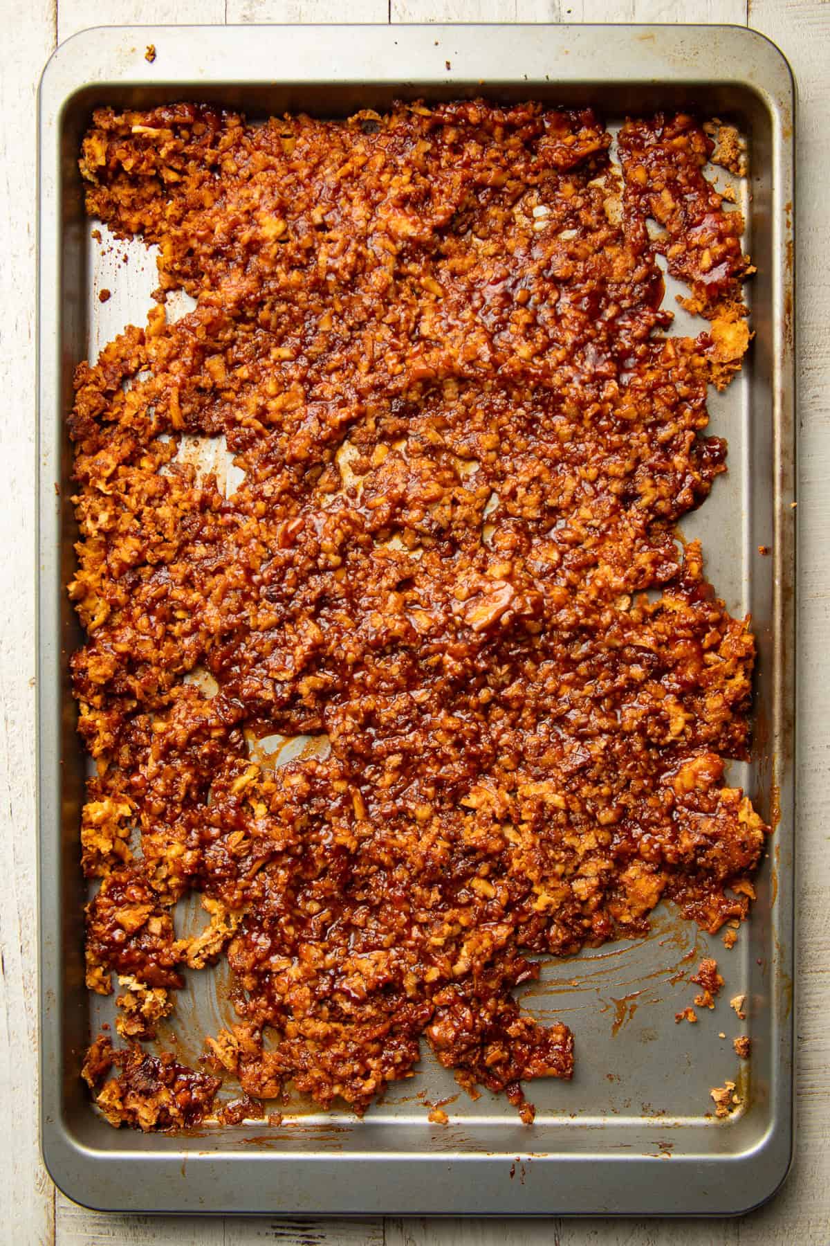 Shredded barbecue tofu on a baking sheet.