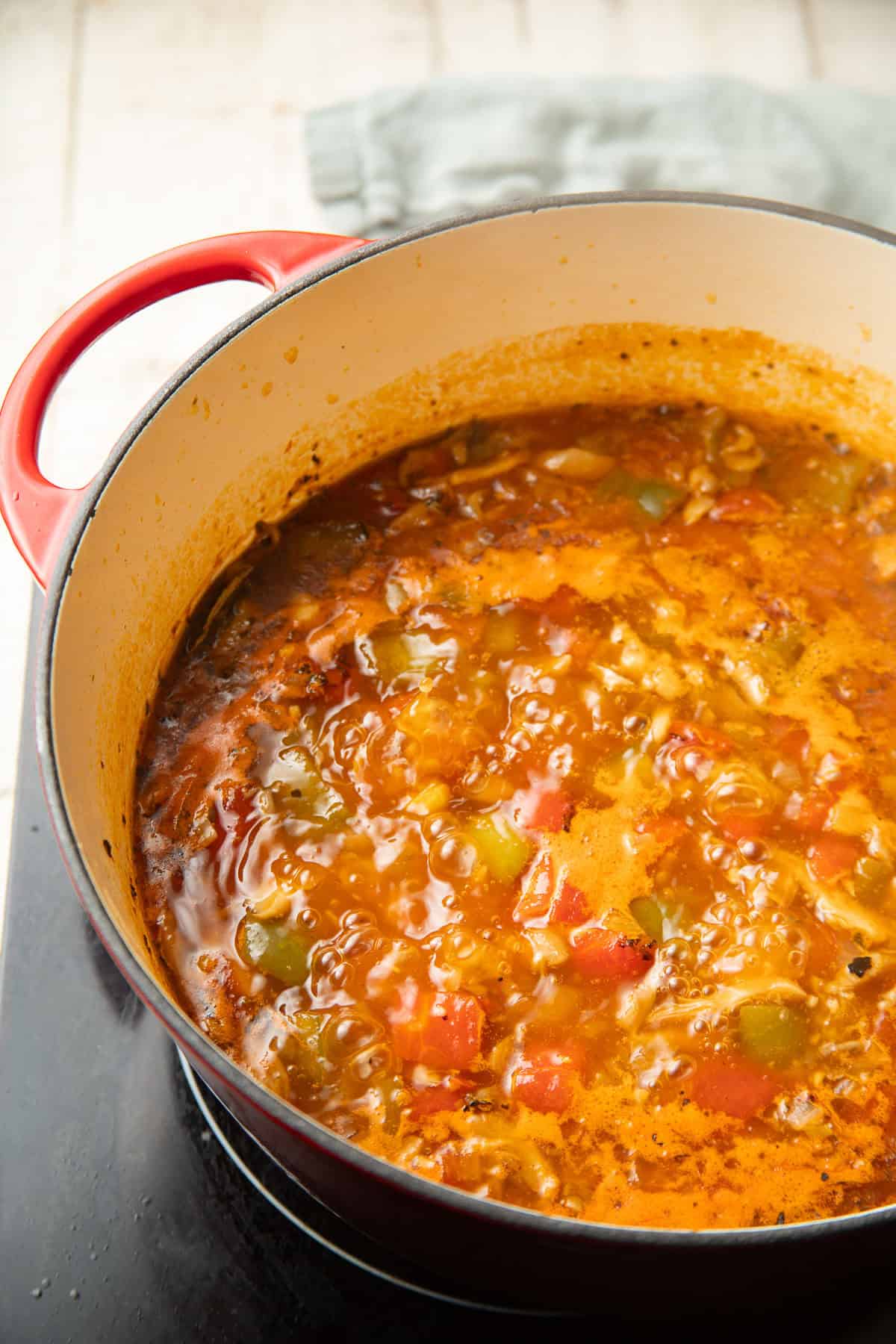 Pot of Vegan Sopa de Lima simmering on the stove.