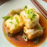 Vegan Agedashi Tofu cubes on a plate.