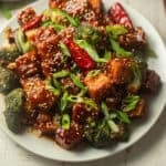 Plate of General Tso's Tofu and broccoli.