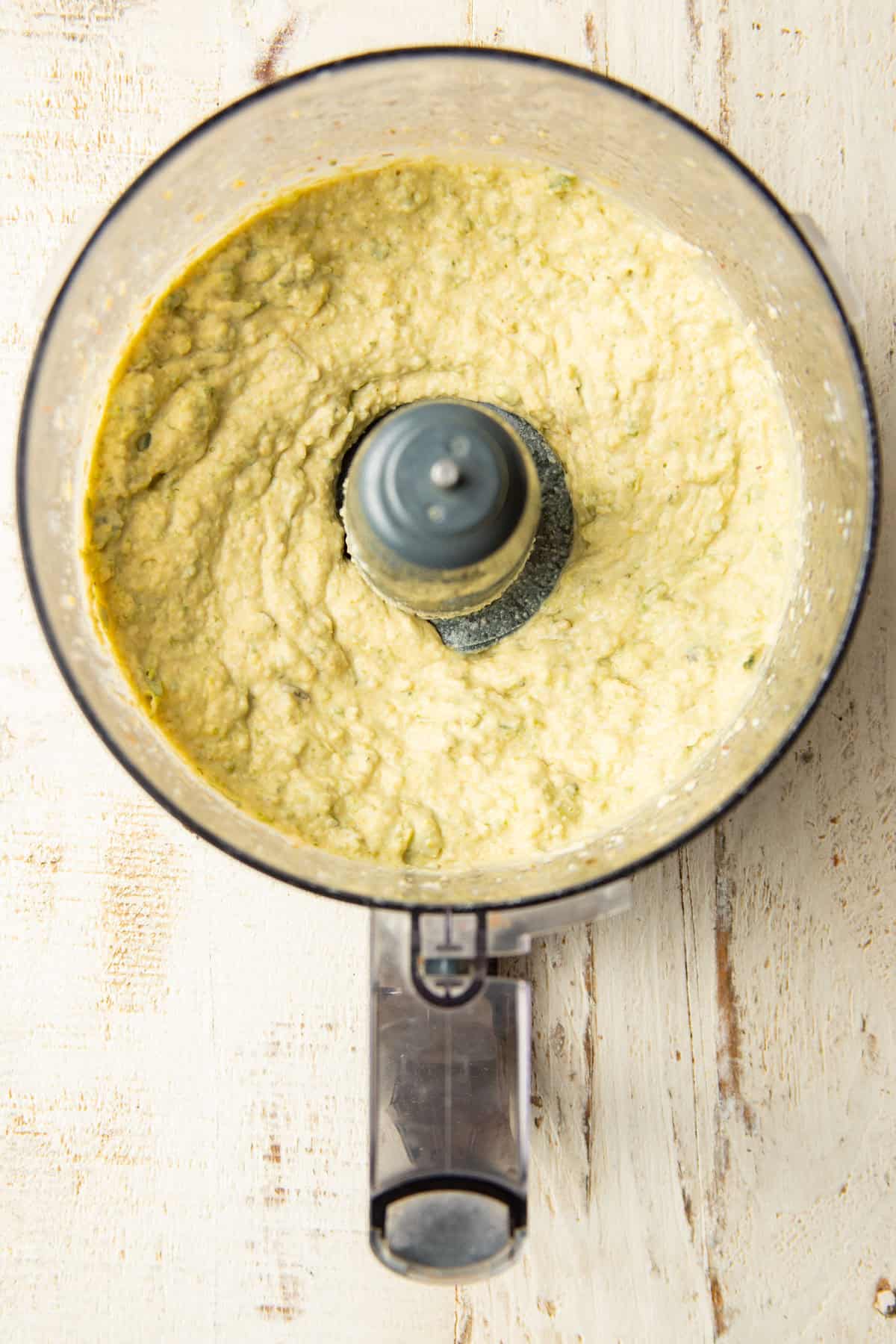 Roasted Jalapeño Hummus in a food processor bowl.