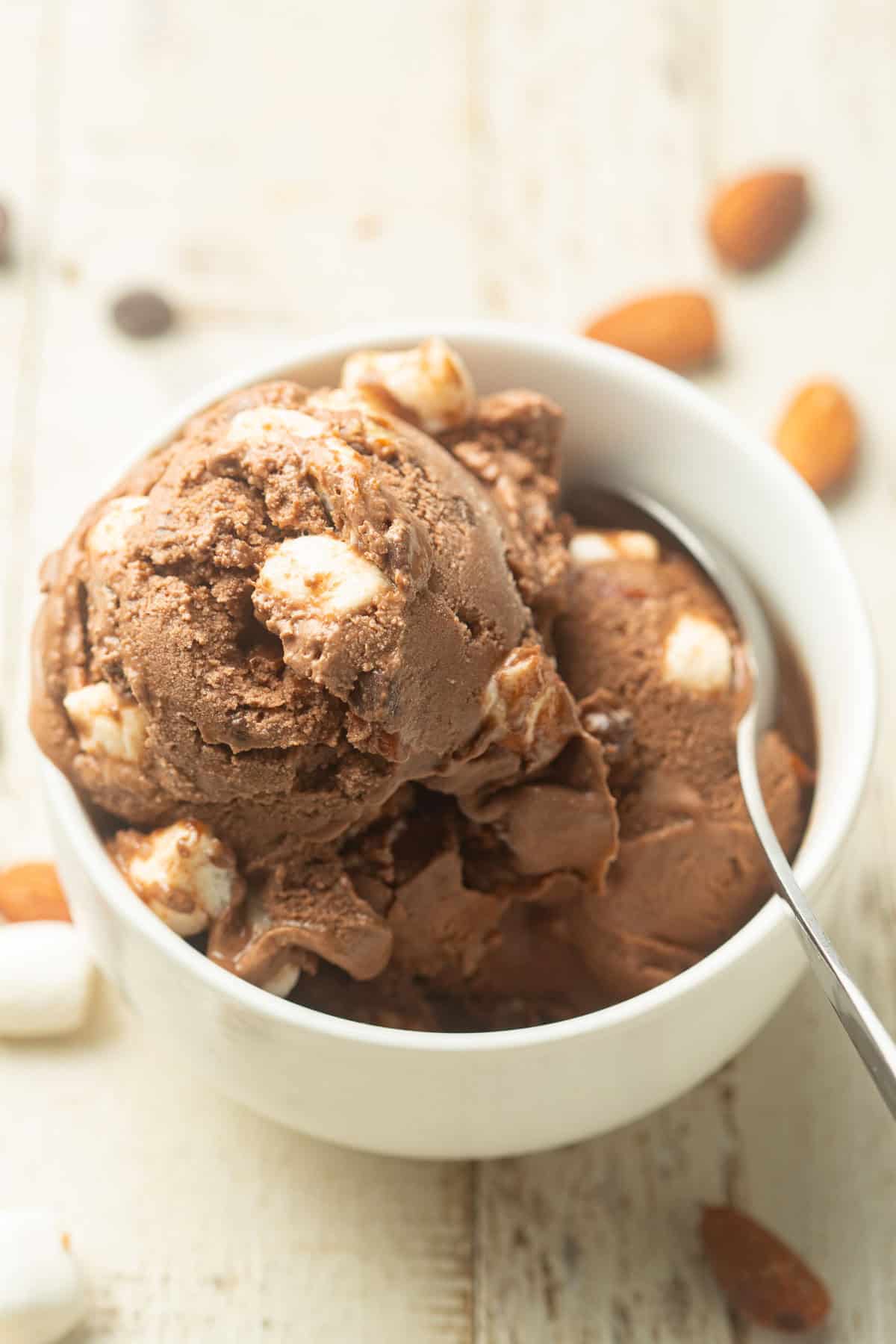 Bowl of Vegan Rocky Road Ice Cream with a spoon.