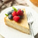 Slice of Vegan Ricotta Cheesecake on a plate with fork.