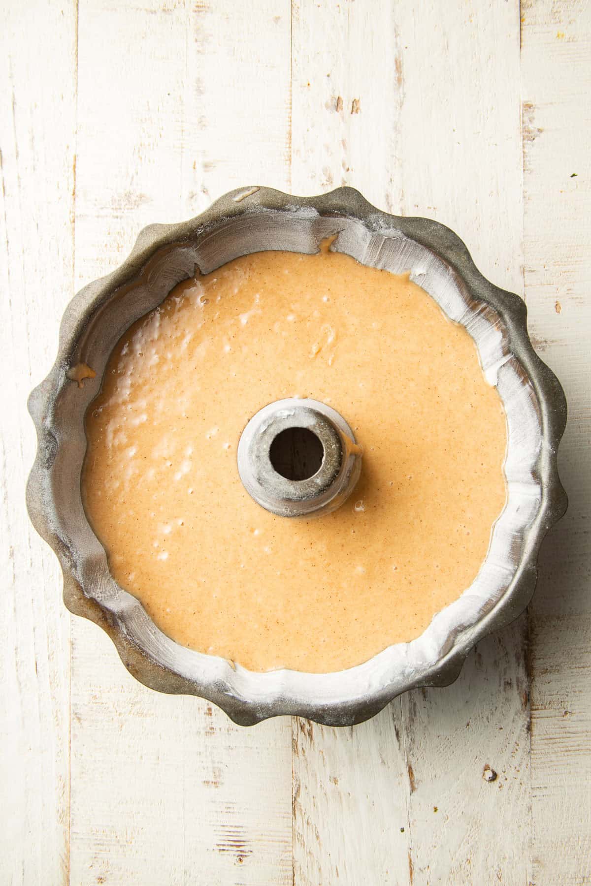 Cake batter in a bundt pan.