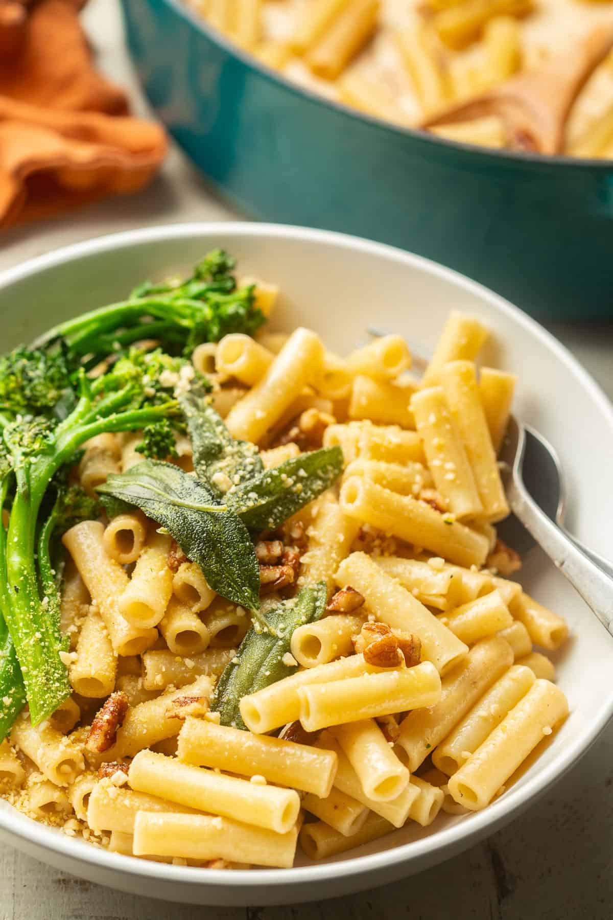 Bowl of Vegan Brown Butter Pasta with fried sage and broccolini.