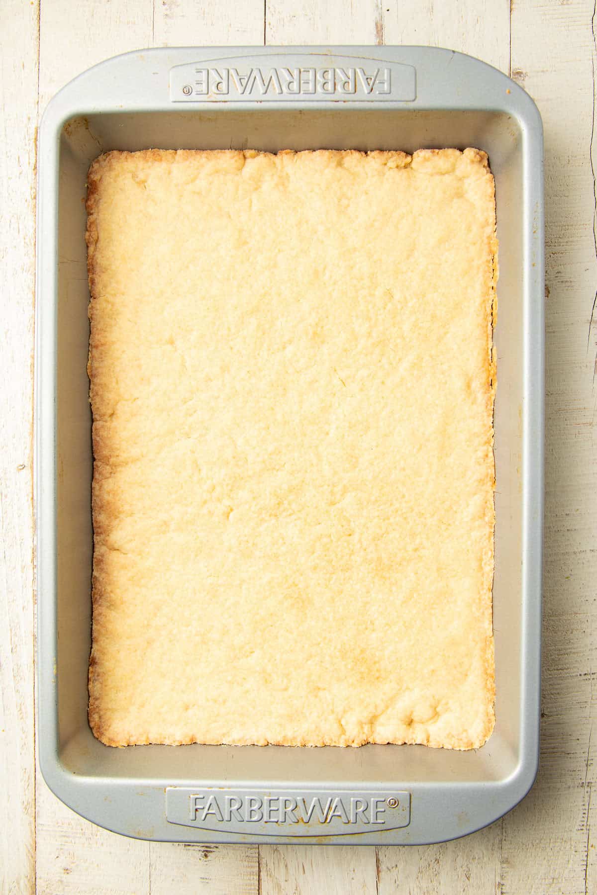 Pumpkin Pie Bar crust in a baking pan.