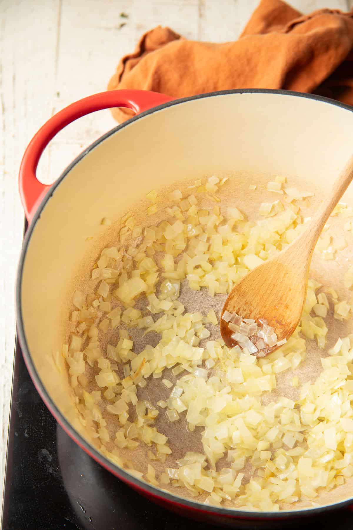 Diced onion cooking in a pot.