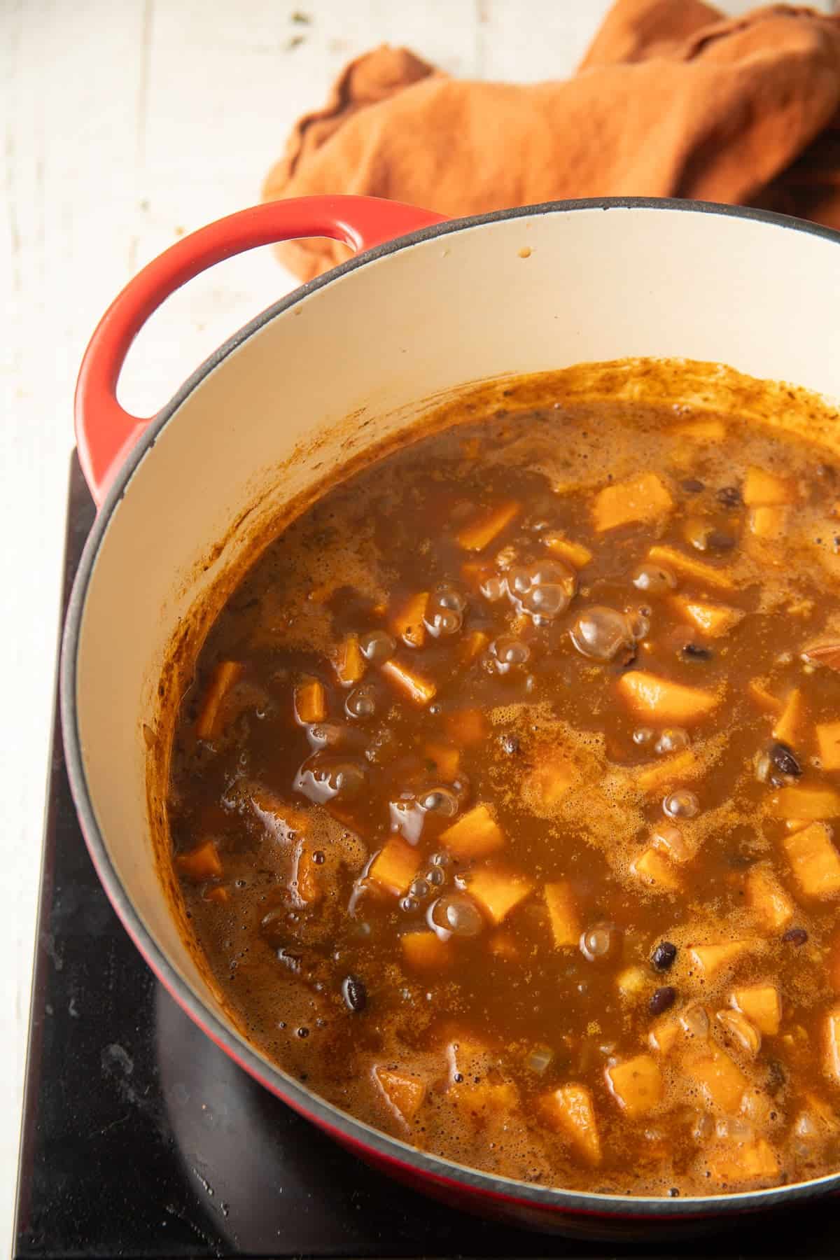 Sweet Potato Black Bean Soup simmering in a pot.